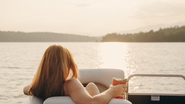 Woman on boat on Lake James in Nebo, N.C.