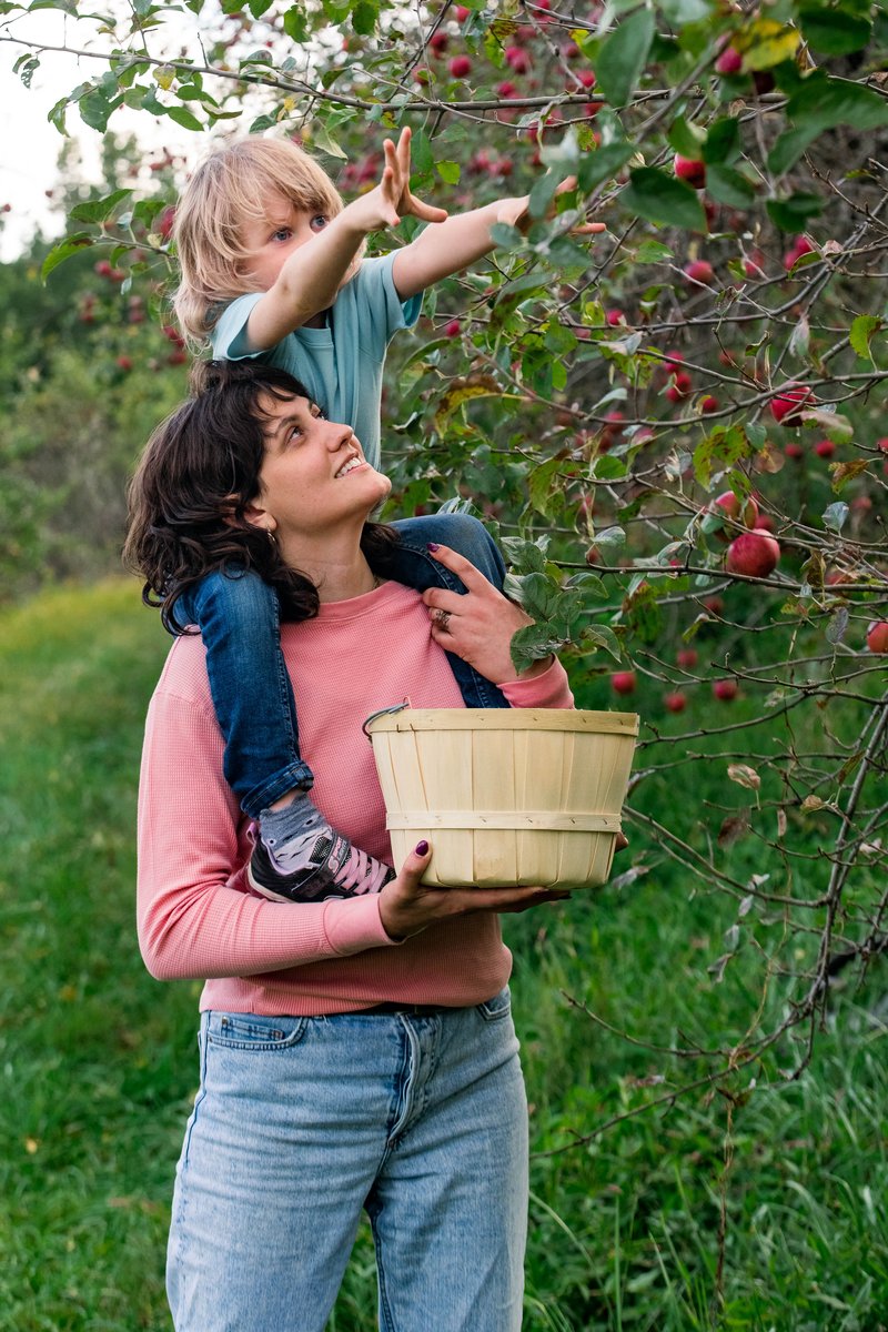 Kid and Mom Picking Apples at The Orchard at Altapass